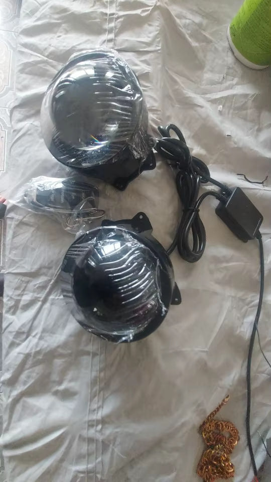 Both lenses still bagged with the wiring harness and control module, laid out before fitting - customer photo